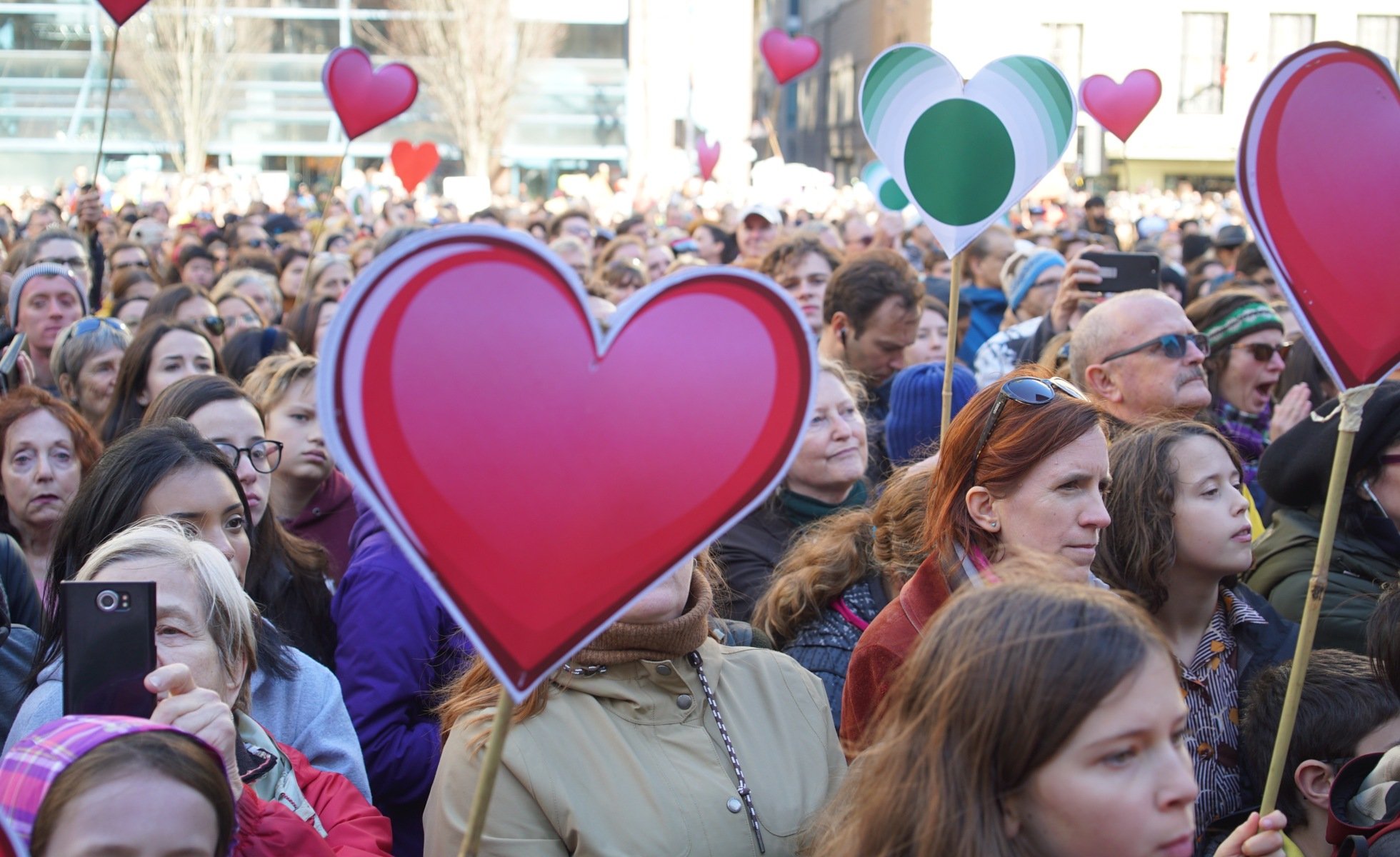 Crowd holding heart signs at Youth Climate Strike