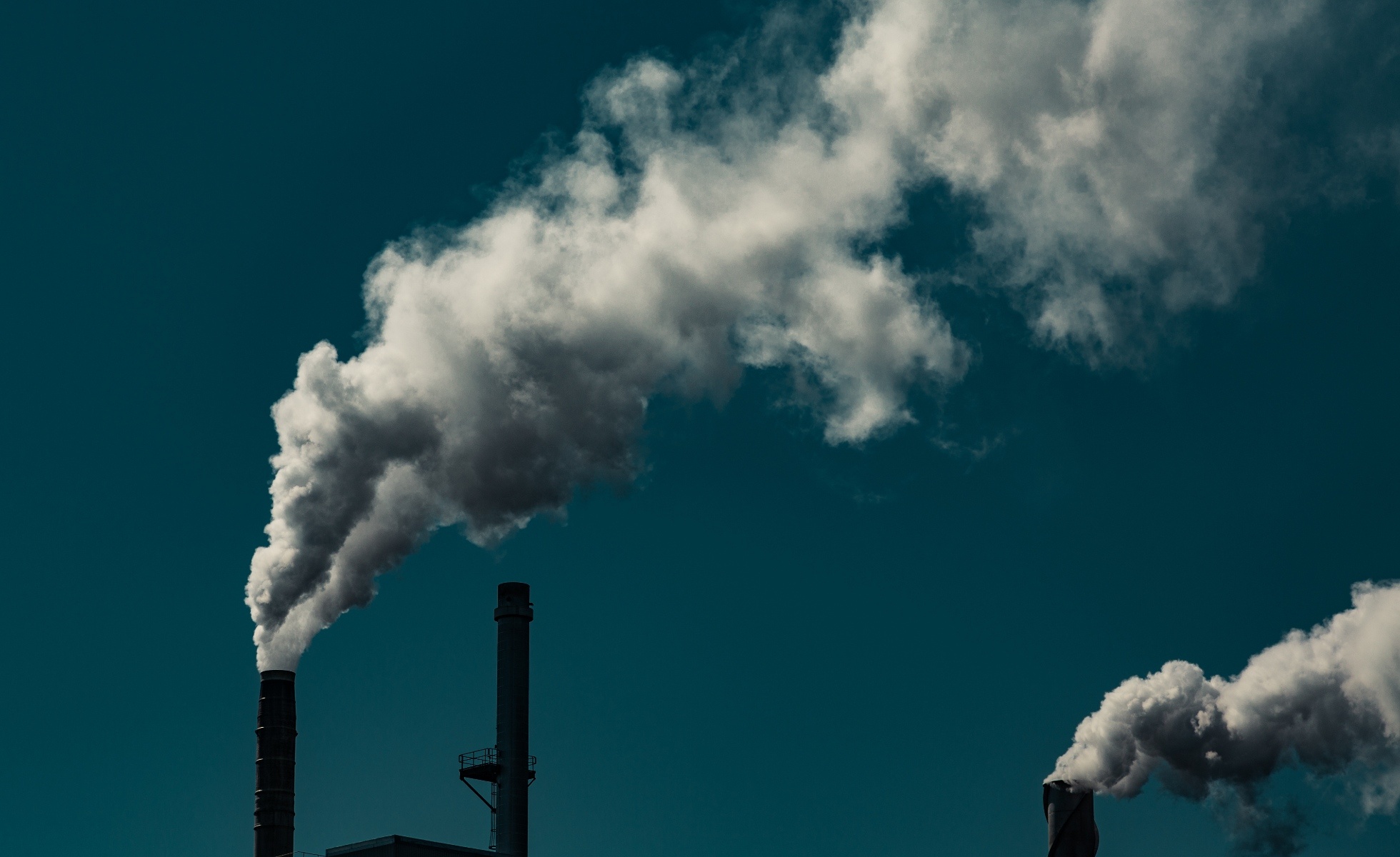 smoke stacks blue sky