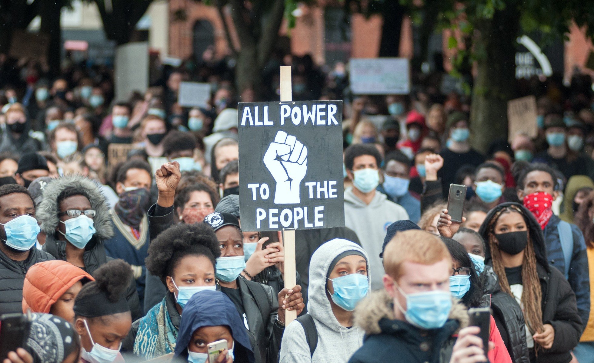 Overview of crowd at Black Lives Matter protest. Sign reading "All Power to the People" centered