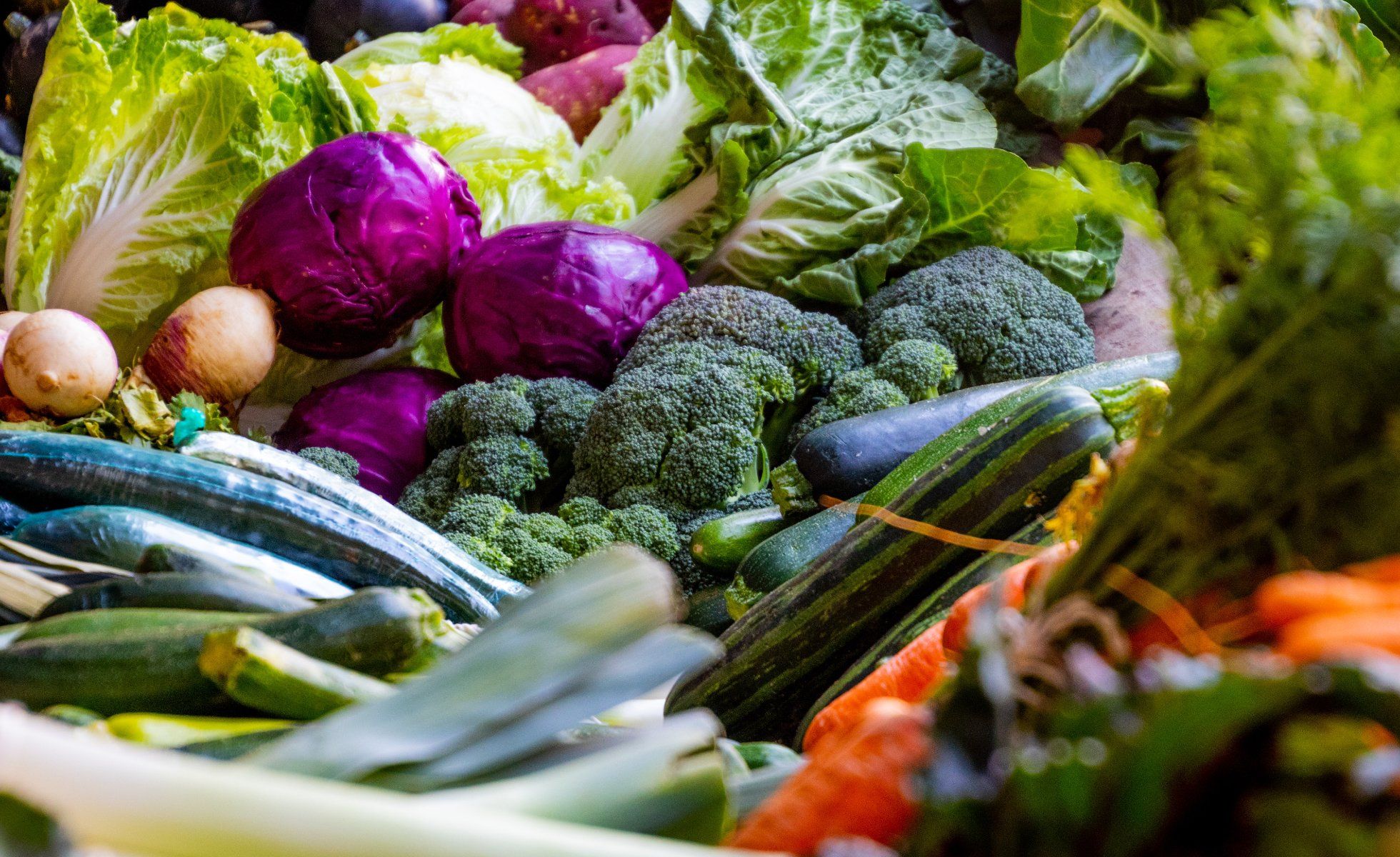 A close up of a variety of vegetables on a stand