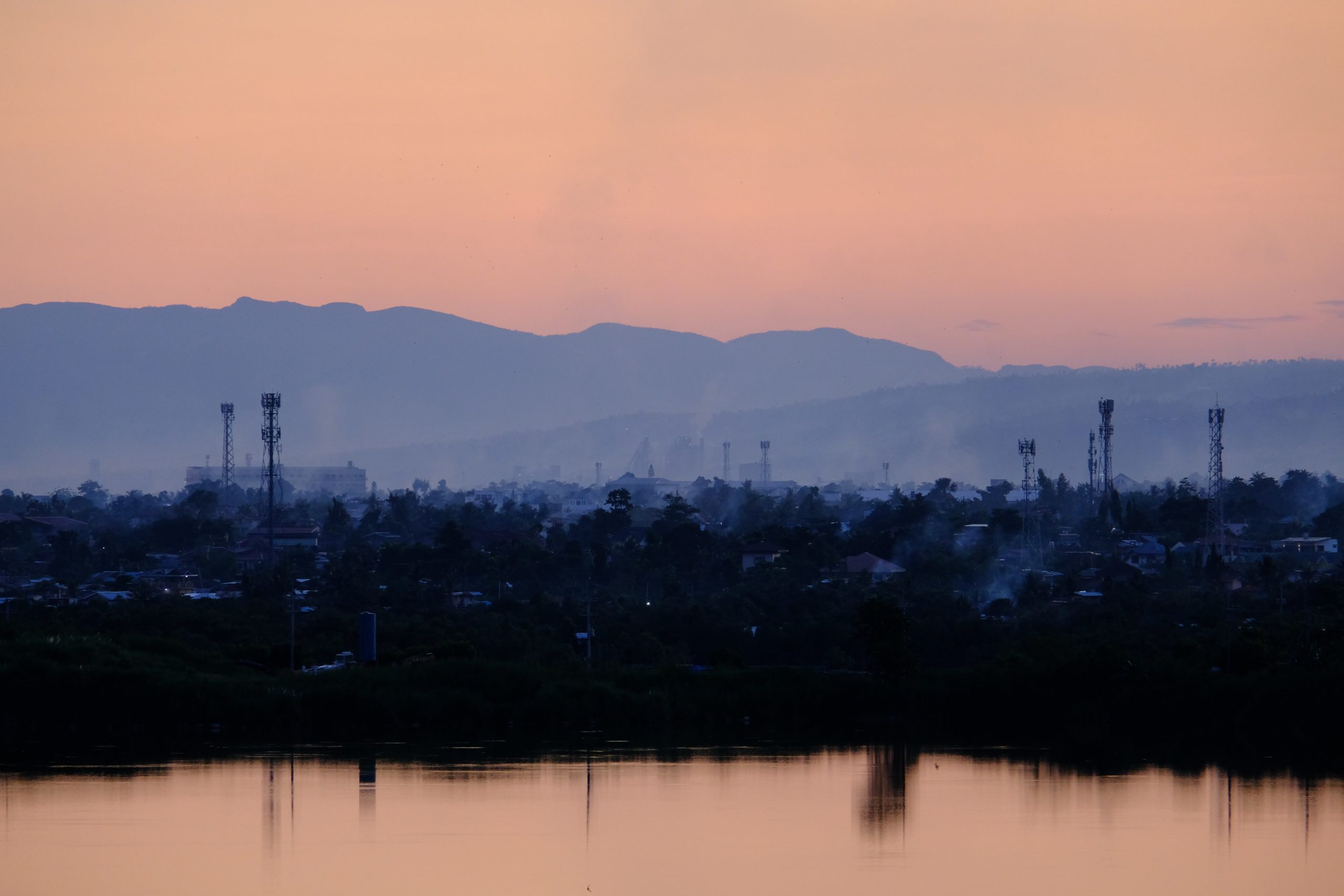 City skyline under pink sky