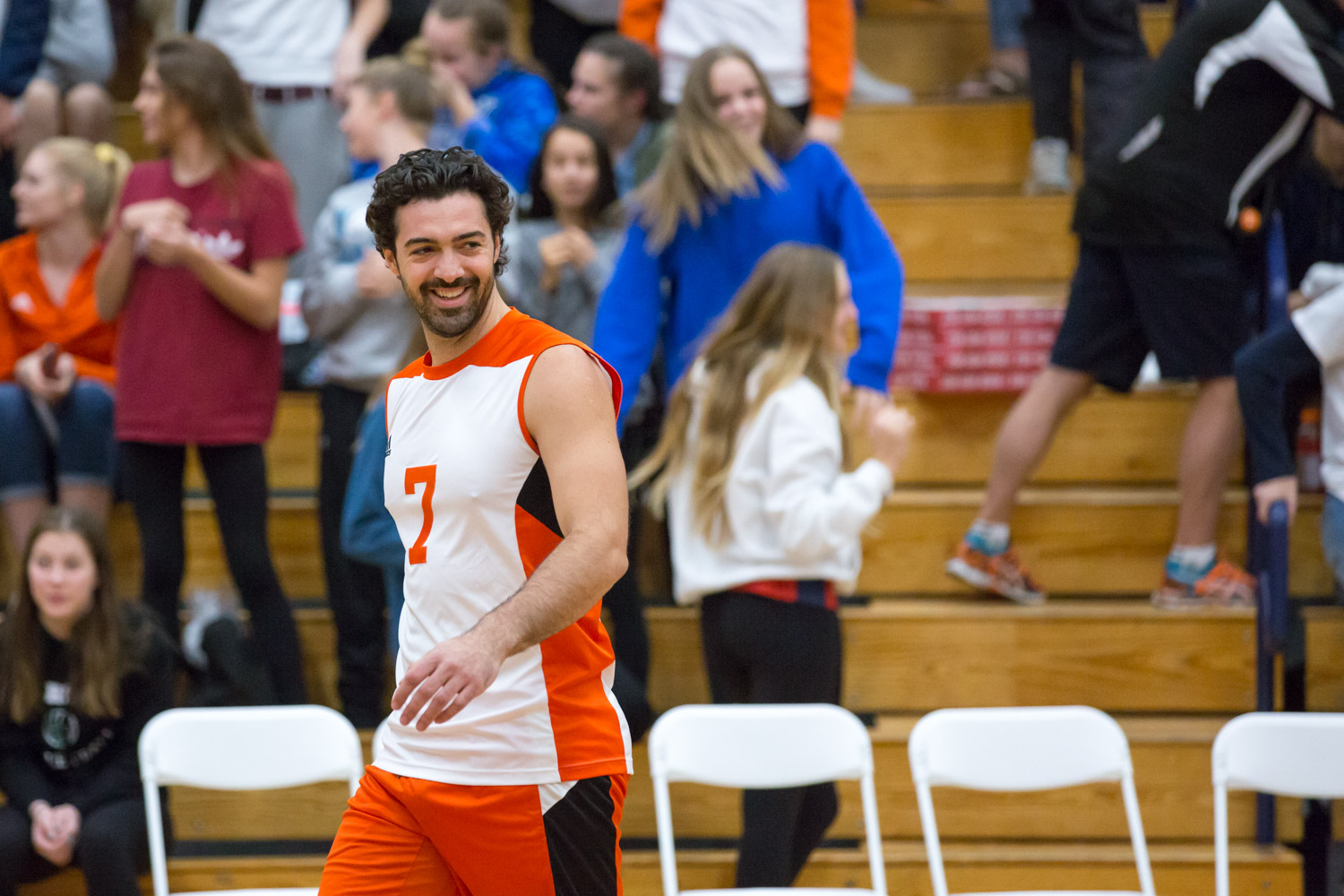 Man smiling on a vollleyball court