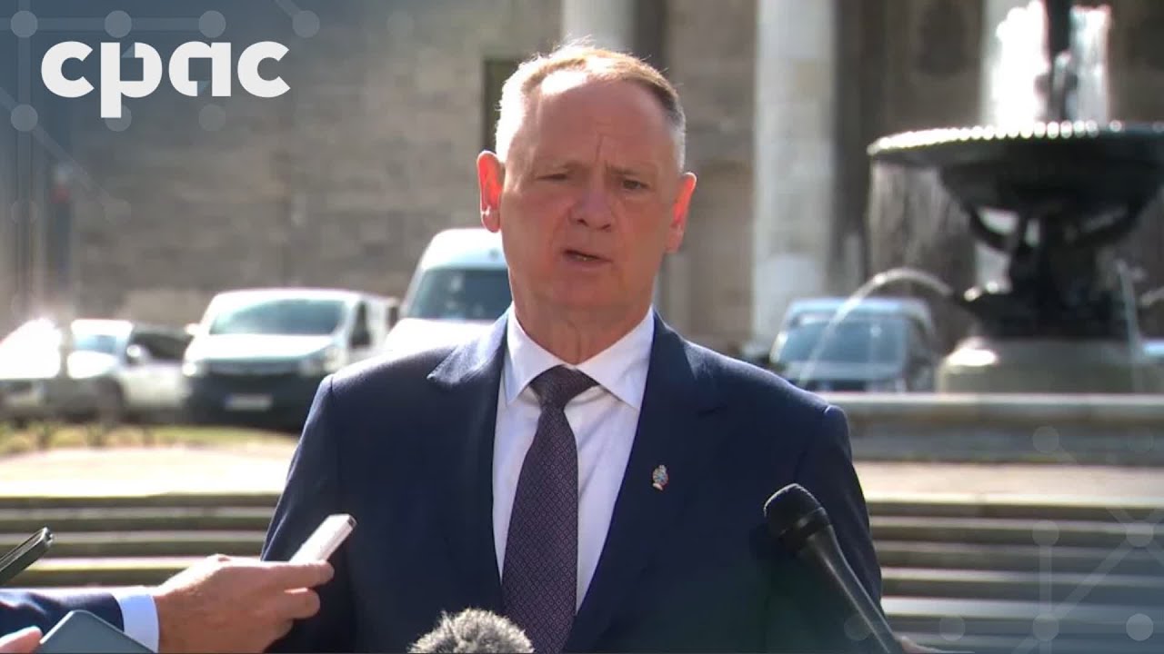 Defence Minister David McGuinty speaks with reporters in Warsaw – August 25, 2025